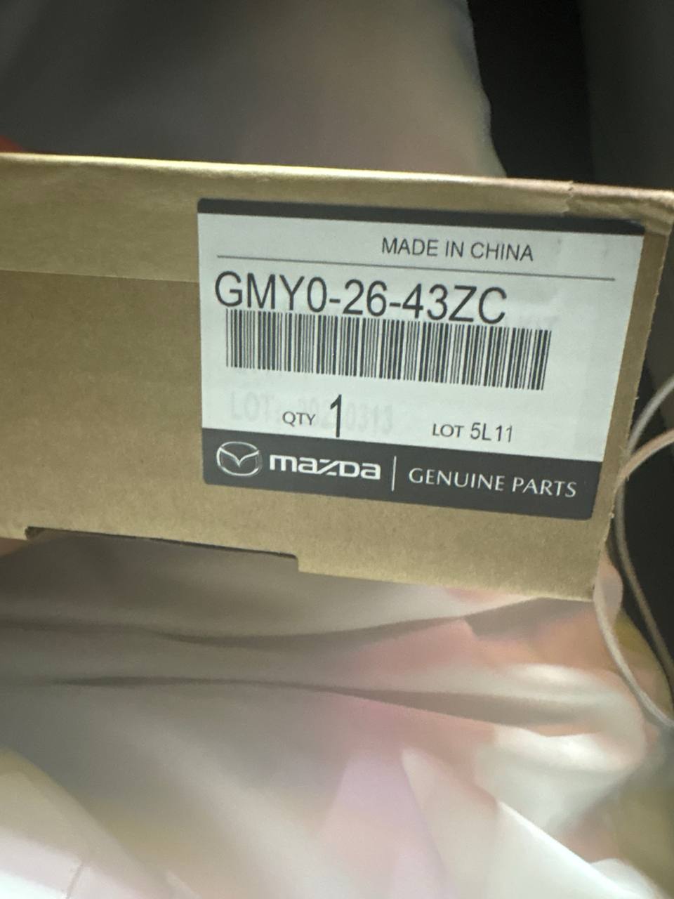 علبة قطع غيار مازدا الأصلية — Genuine Parts مع رقم القطعة